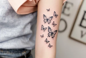 Tattoo of about 10 butterflies that look 3d with lines
 and different sizes spaced out between wrist and elbow tattoo idea