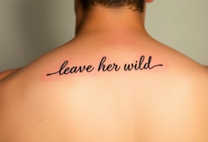 small fine line script tattoo of words "leave her wild" tattoo idea