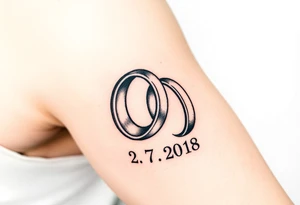 two wedding rings with date 22. 7. 2018 tattoo idea