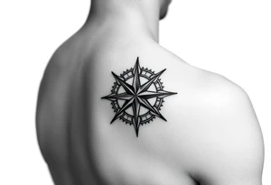 intricate compass rose on upper right back shoulder of a man. black and white. tattoo idea