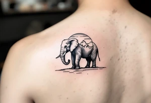 An elephant with mountains and the sunset in the background tattoo idea