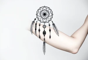 native dreamcatcher with flowing feathers and sacred beads tattoo idea