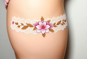 A soft peony lace garter tattoo with pastel pink petals with golden leaves tattoo idea