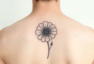 Minimalists marigold flower with g tattoo idea