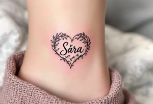 A heart shaded in pinky with Sára in a handwritten-style font inside. tattoo idea