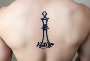 A queen chess piece with the name Katlyn incorporated into the bottom of the piece tattoo idea