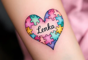 A heart made of puzzle pieces, each piece a different pastel, with name Lenka in the center. tattoo idea