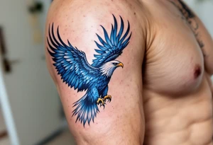 A vibrant blue soaring eagle symbolizes freedom and strength in the face of adversity. tattoo idea