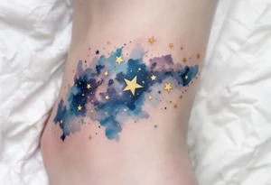 Capricorn stars inked in metallic gold, forming a delicate arc across a watercolor galaxy. tattoo idea