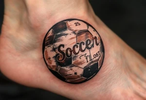 A vintage-style soccer ball shaded in sepia and brown tones with cursive lettering. tattoo idea