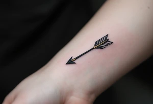 A sleek black ink arrow with a delicate gold accent running along its shaft, symbolizing elegance and direction. tattoo idea