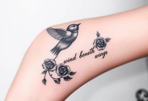 Soaring robin with trail of red rose petals with writing saying wind beneath my wings tattoo idea