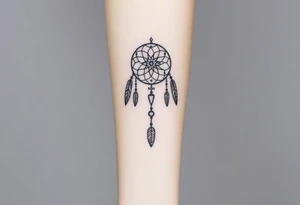 native dreamcatcher with flowing feathers and sacred beads tattoo idea