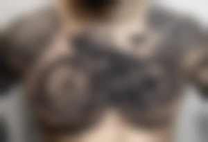 Chest tattoo, someone has pulled back the skin to reveal a bicycle gear tattoo idea