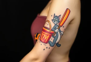 Childhood memories of a small pile of books, a bucket and spade, a football, a cricket bat, a cartoon of Tom from Tom and Jerry tattoo idea