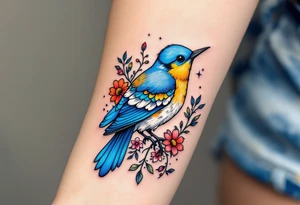 Puffy bluebird surrounded by wild flowers tattoo idea