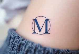 An elegant serif "M" in midnight blue, placed within a fine circular frame. tattoo idea