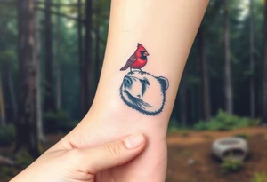 Cardinal sitting on a bear’s nose. The bear looks happy. Forest background tattoo idea