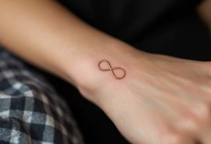 Three different infinity symbols in gold, silver, and rose gold, each person (three) has its own tattoo idea