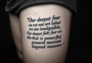 the quote is “ Our deepest fear is not that we are inadequate, Our deepest fear is that we are powerful beyond measure” intertwined with meaningful basketball jerseys or events tattoo idea