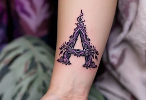 A stitched "A" design in dark purple and black, resembling embroidery. tattoo idea