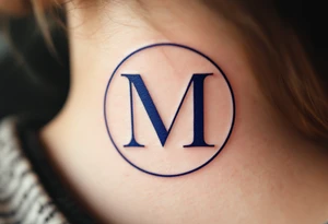An elegant serif "M" in midnight blue, placed within a fine circular frame. tattoo idea