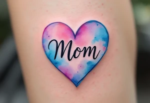 A watercolor heart in pink and blue with the word “Mom” scripted across it in elegant cursive. tattoo idea
