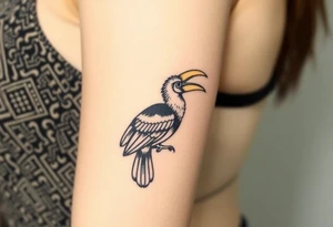 image of a Kalimantan ivory-horned hornbill with a Dayak motif woven background tattoo idea