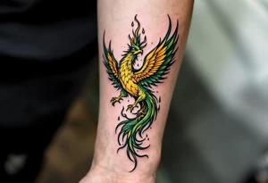 A green and yellow phoenix rising from flames embodies rebirth and freedom. tattoo idea