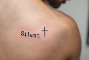 A tiny symmetrical cross under a man’s left eye, in charcoal black, paired with "Silent" in serif caps under the right. on man´s face under an eye. tattoo idea