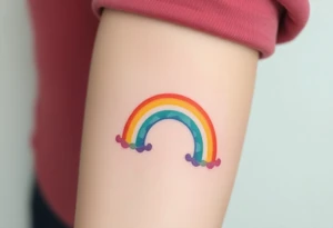 A rainbow with a halo above it to honour a rainbow baby tattoo idea