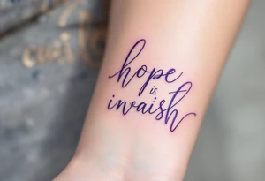 A soft script in pastel pink and lavender, wrapping around the wrist, symbolizing hope and inner faith. tattoo idea