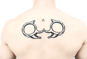 brass knuckles gangster vibe tattoo idea