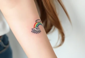 A rainbow with angel wings and halo tattoo idea
