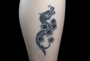 Leg area back of calf dragon going up 4 flowers tattoo idea