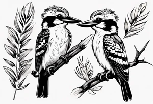 Small kookaburra sitting on wattle leaves tattoo idea