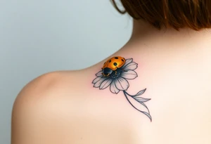 Golden or yellow ladybug on a whispy flower tattoo idea