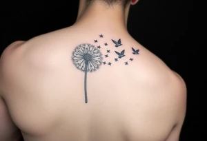 A dandelion with its leaves blowing away and turning into birds that fly up and create a waterfall tattoo idea