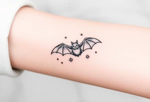 Small bat flying in front of stars tattoo idea