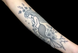 ethereal mermaid with flowing hair among coral and sea flowers tattoo idea