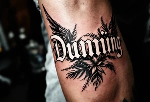 Dunning, left forearm details include angel wing, greek type of font,jungle leaves, name is big and in white color tattoo idea