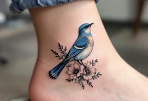 Blue bird with thick floral at the bottom tattoo idea