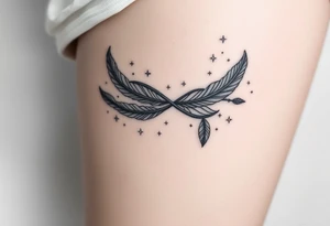 infinity symbol woven with floating feathers and stardust tattoo idea