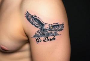 Philadelphia Eagle flying over Philadelphia city skyline faded with a Go Birds written under it tattoo idea