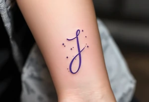 Whimsical curly "J" in lavender with tiny stars dotting the tail. tattoo idea