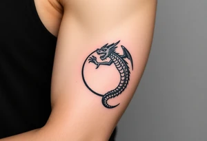 a dragon forming a circle with its body tattoo idea