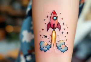 A playful rocket ship blasting off in vibrant reds and oranges, trailing stars that form the son’s initials TM in the sky. tattoo idea