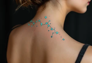 The Pisces constellation is dotted with tiny aquamarine stars that flow like water along the spine. tattoo idea