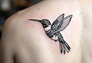 small hummingbird with indigenous style tattoo idea