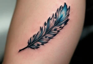 A black ink feather turning into birds, with one bird in light blue representing the son’s spirit. tattoo idea